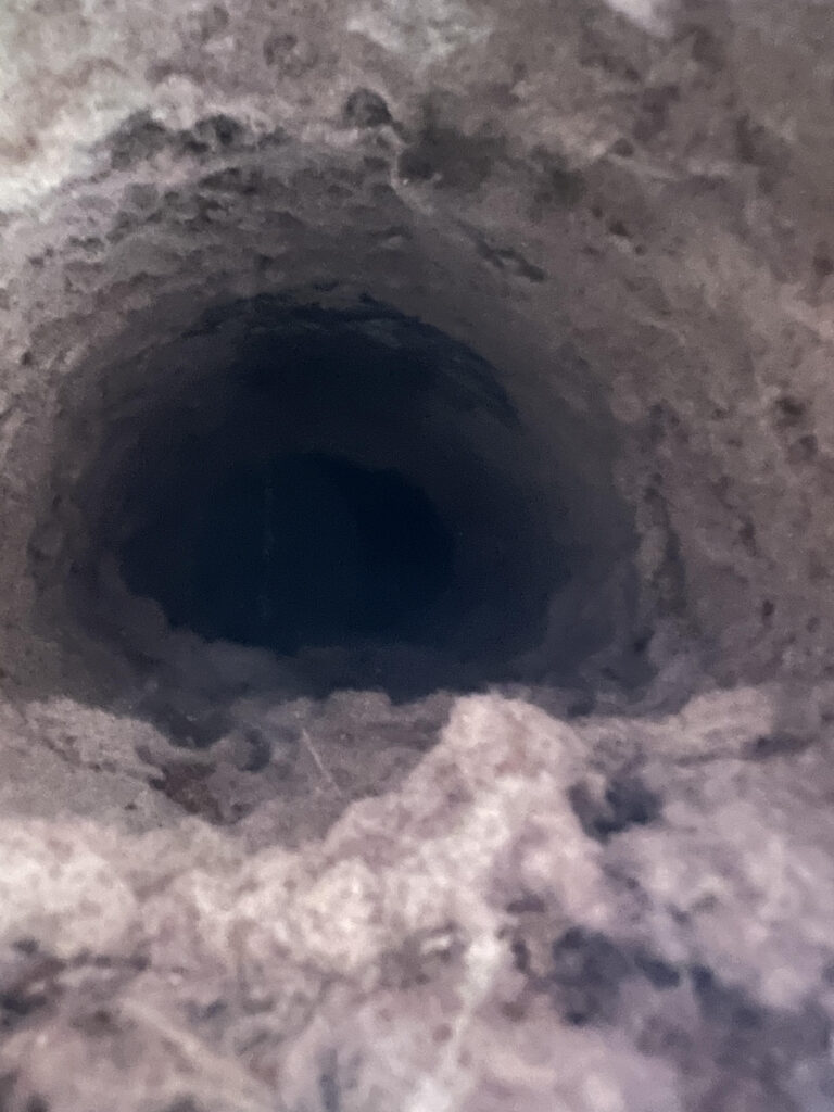 A dirty dryer vent before a dryer vent cleaning in Maplewood, Mn.