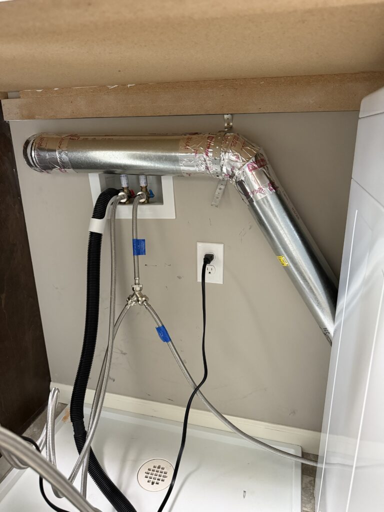 Dryer vent reroute in the second story laundry room