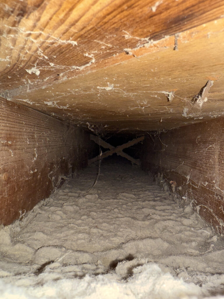A very dirty air duct before an air duct cleaning in Lino Lakes, Mn